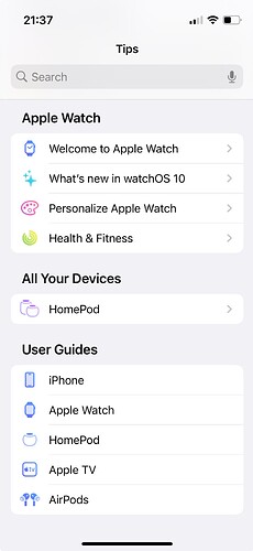 Main screen of the Tips app on iOS, showing three sections of topics labeled, "Apple Watch," "All Your Devices," and "User Guides." The latter section contains five entries: "iPhone," "Apple Watch," "HomePod," "Apple TV," and "AirPods."